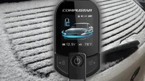 The Compustar T13 Remote Starter hovering in the air in front of a car with snow all over it